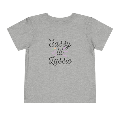 Comfortable funny graphic toddler tee stating 'Sassy Lil Lassie' in color  athletic heather