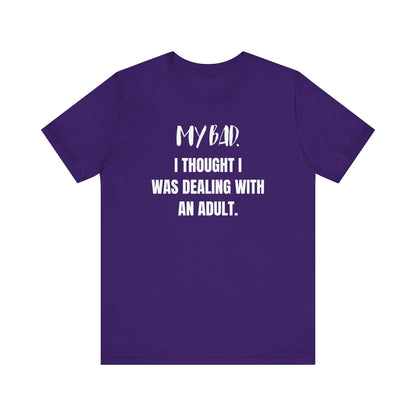 Witty graphic tee stating 'My Bad. I thought I was dealing with an adult.' in color purple