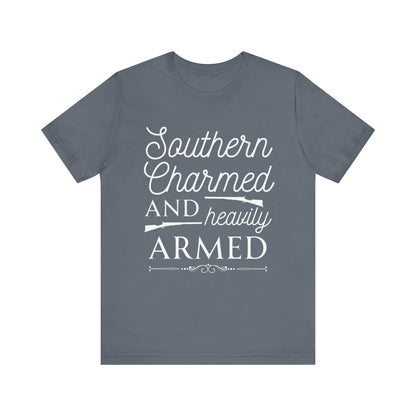 Adult unisex t-shirt stating 'Southern Charmed and Heavily Armed' in color steel blue