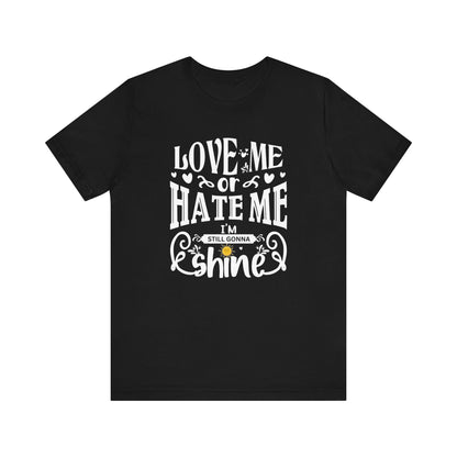 Women's good vibes graphic tee stating 'Love me or hate me, I'm still gonna shine' in color black
