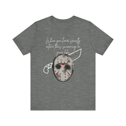 Unisex Comfortable Halloween tee with Jason mask that says 'When you hear sexually active teens swimming in your lake' in color deep heather