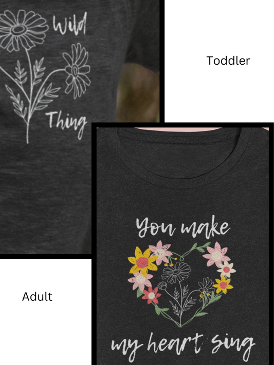 Graphic t-shirt bundle with one toddler tee stating 'Wild Thing' and one adult tee stating 'You Make My Heart Sing' in color dark grey heather