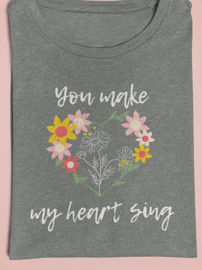 Adult graphic tee stating 'You Make My Heart Sing' in color deep heather
