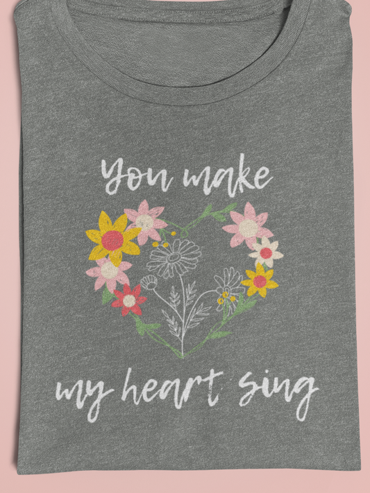Adult graphic tee stating 'You Make My Heart Sing' in color deep heather