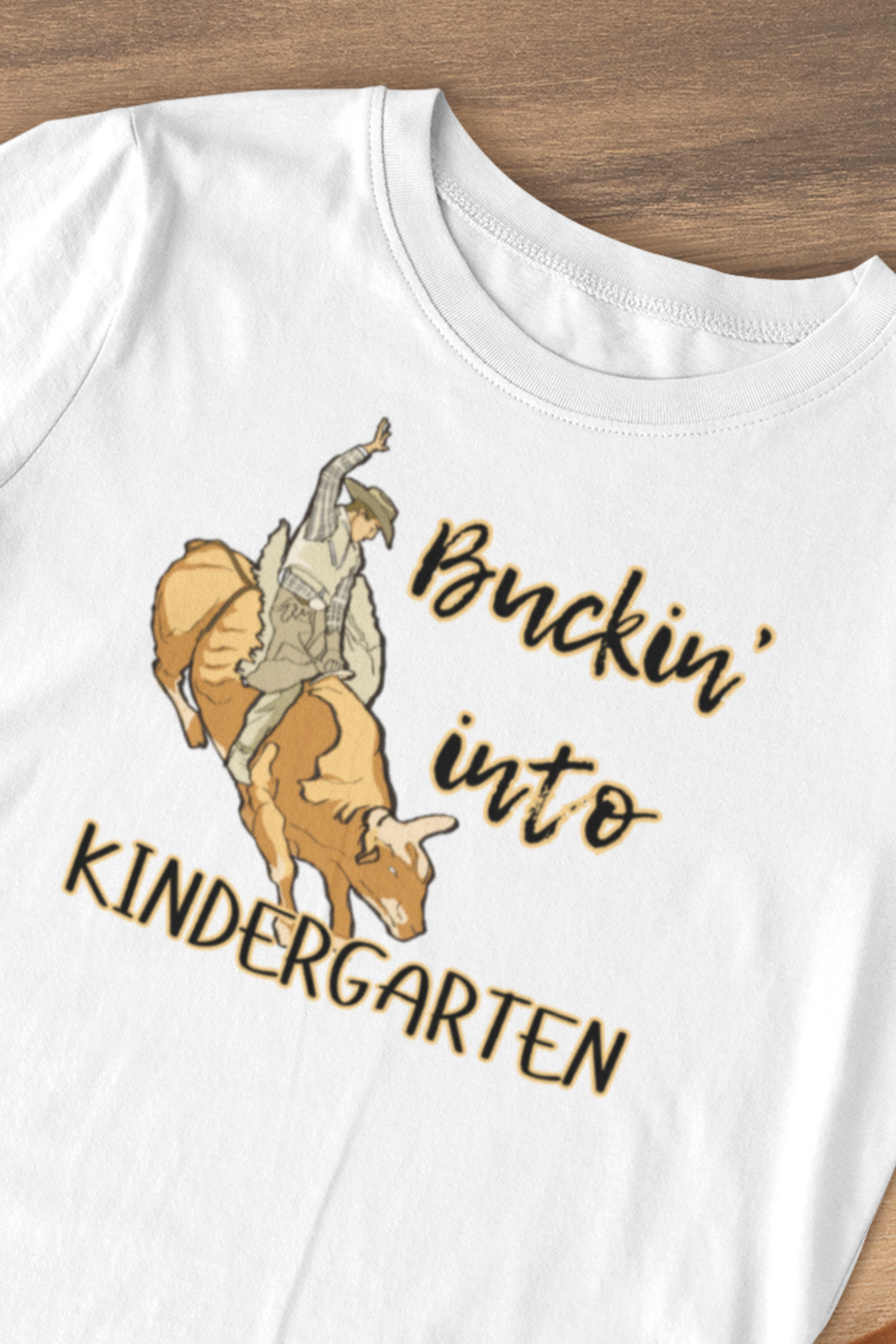 Comfortable toddler tee stating 'Buckin' into Kindergarten' in color white