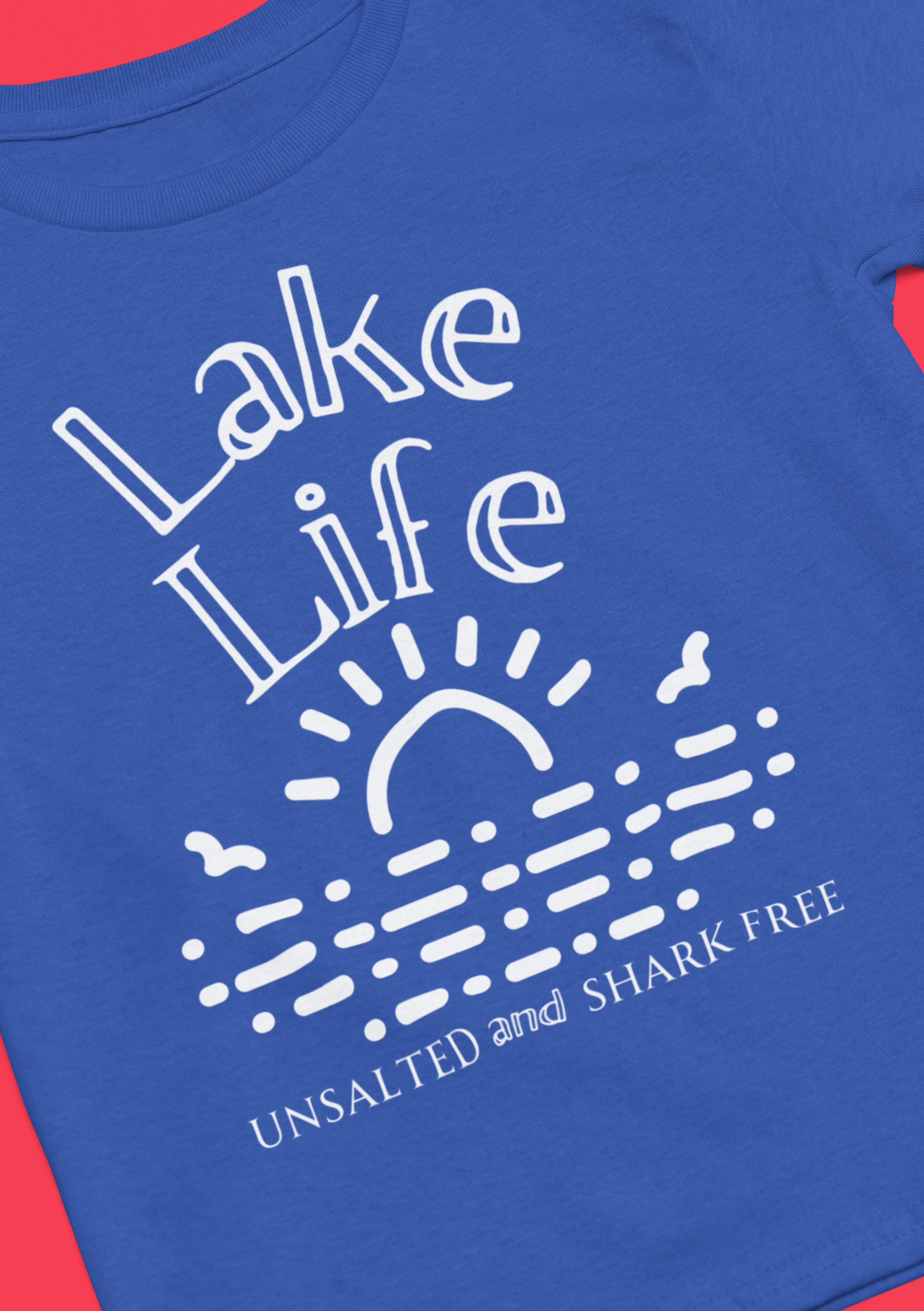 Funny t-shirt stating 'Lake Life Unsalted and Shark Free' in color true royal