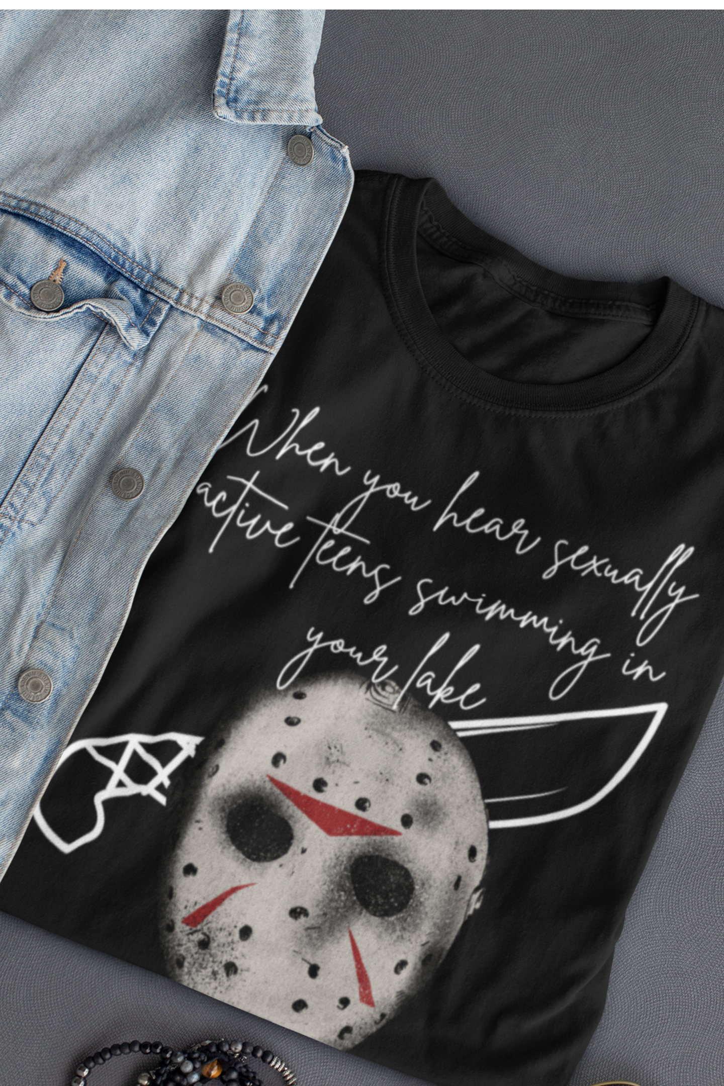 Unisex Comfortable Halloween tee with Jason mask that says 'When you hear sexually active teens swimming in your lake' in color black