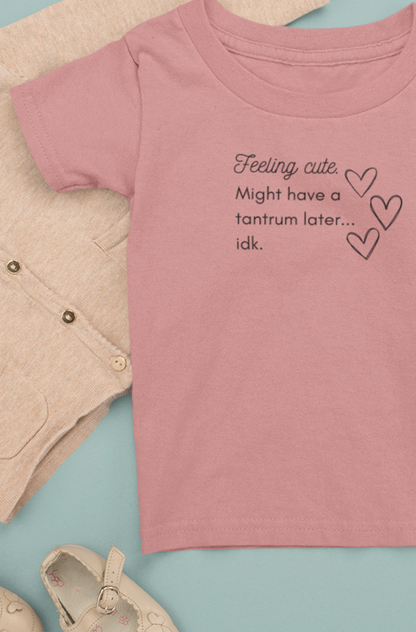 Comfortable funny graphic toddler tee stating 'Feeling cute. Might have a tantrum later...idk' in color heather mauve