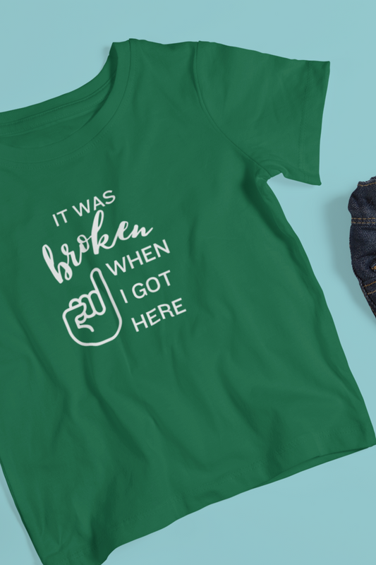 Comfortable funny graphic toddler tee stating 'It was broken when I got here' in color kelly