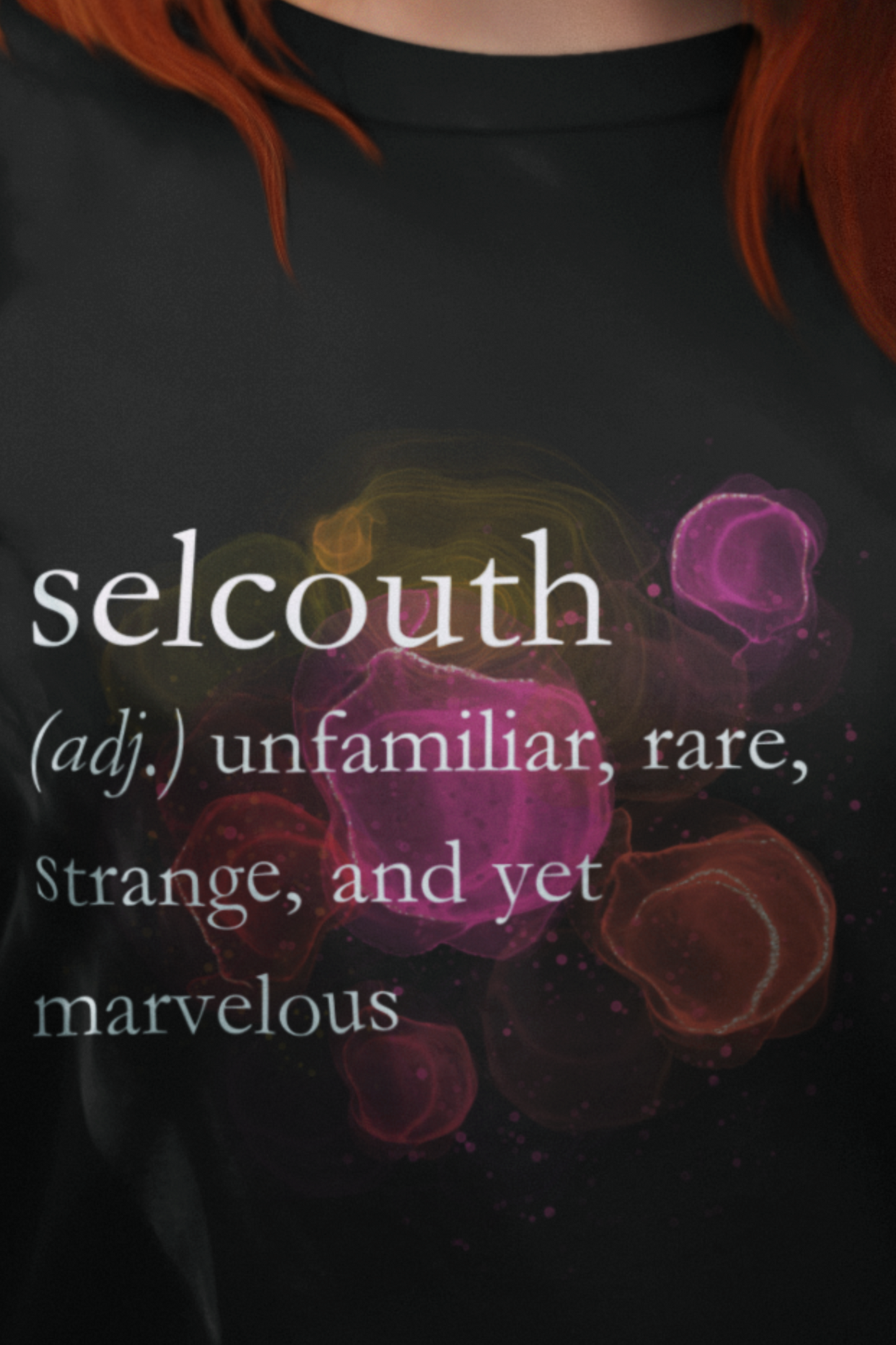 Woman wearing comfortable women's good vibes tee that states 'selcouth (adj.) unfamiliar, rare, strange, and yet marvelous' in color black