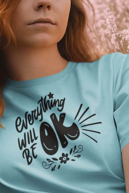 Red headed woman wearing a soft comfortable t-shirt stating 'Everything will be OK' in color turquoise