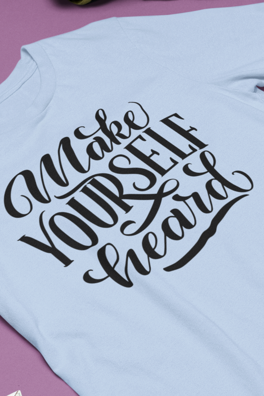 Good vibes graphic tee stating 'Make Yourself Heard' in color baby blue