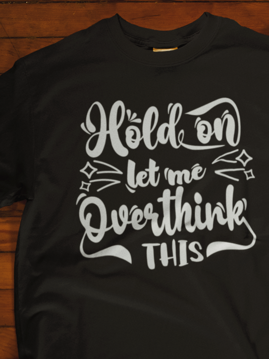 Unisex graphic tee stating 'Hold on let me overthink this' in color black