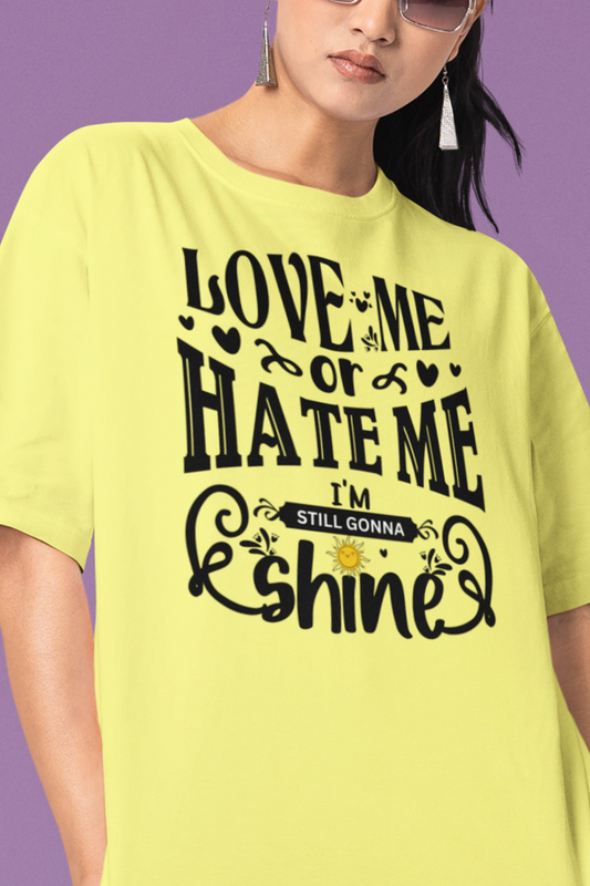 Women's good vibes graphic tee stating 'Love me or hate me, I'm still gonna shine' in color yellow
