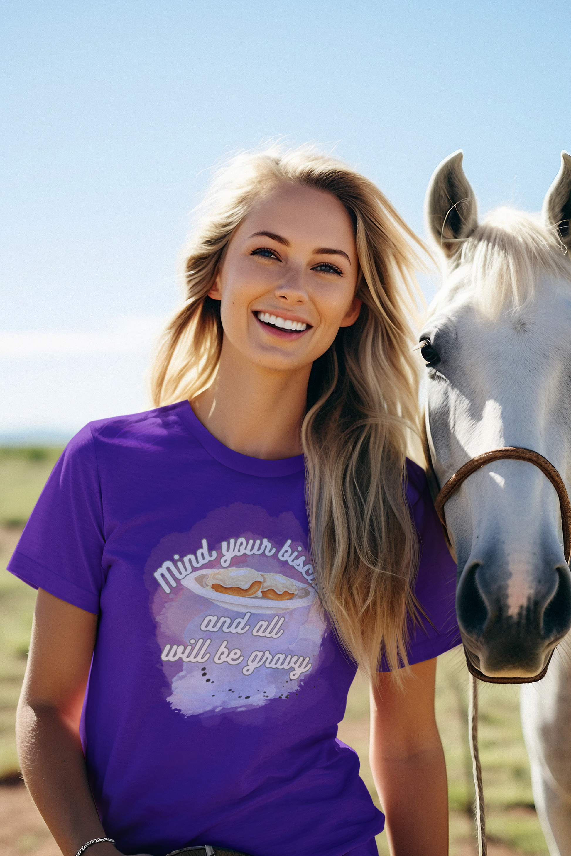Woman smiling with horse wearing a comfortable funny southern graphic tee stating Mind You Biscuits and All will be Gravy in color purple
