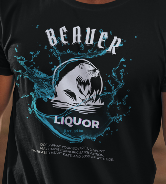 Man wearing cowboy hat and comfortable graphic tee stating Beaver Liquor est. 1988 Does what your boyfriend wont. May cause euphoric satisfaction, increased heart rate, and loss of attitude in color Black.